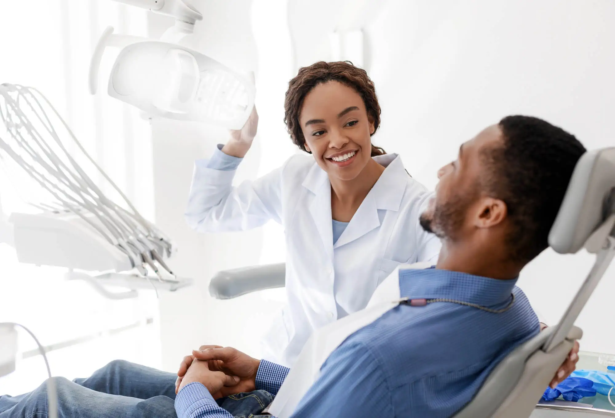Dentist consulting male patient in chair best dentist Antioch, TN