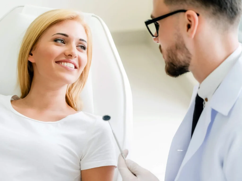 Smiling woman talking with dentist best dentist Antioch, TN