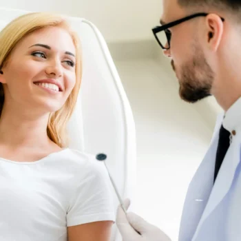 Smiling woman talking with dentist best dentist Antioch, TN