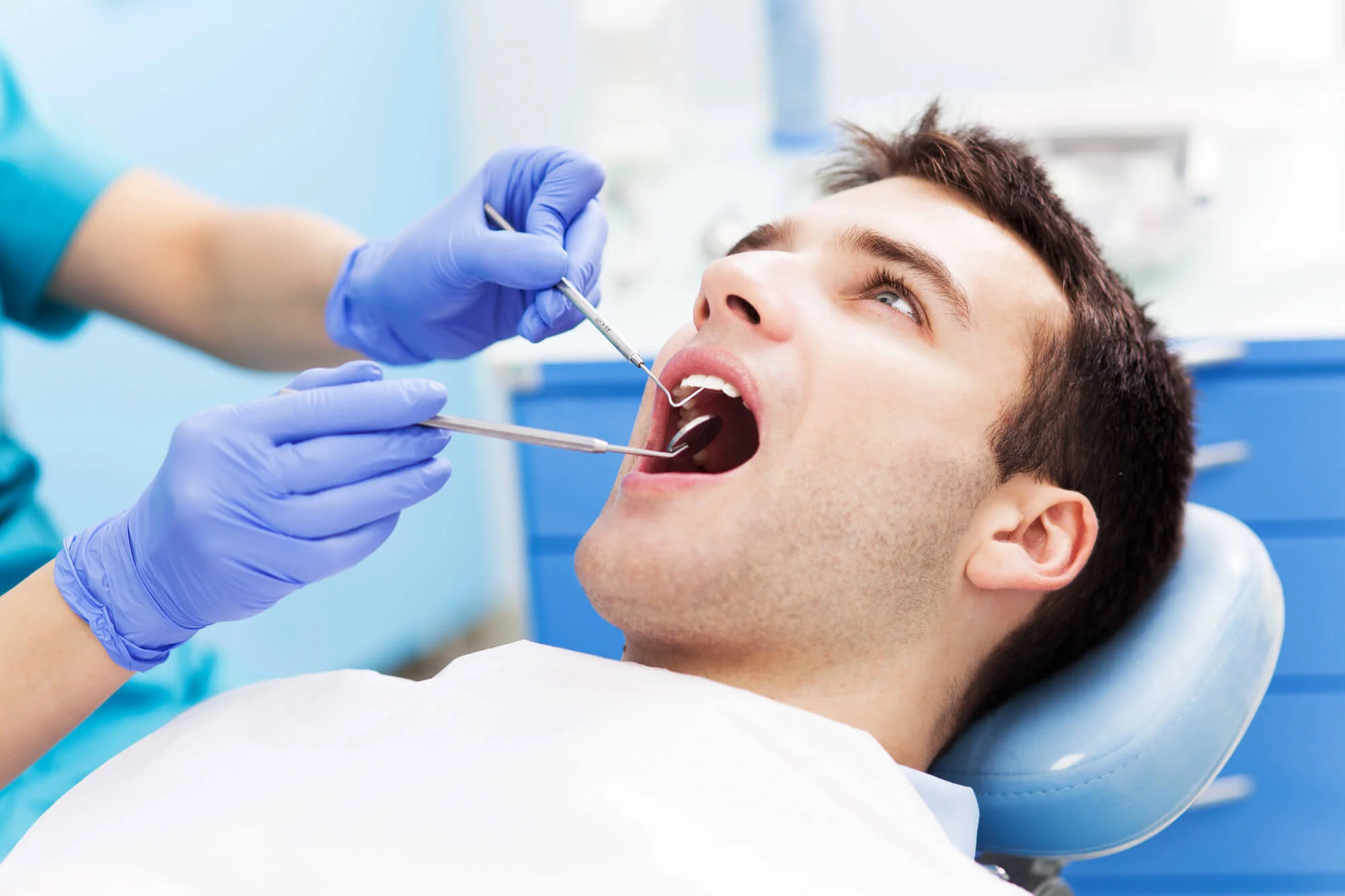 Patient receiving urgent dental treatment — emergency tooth extraction in Nashville, TN